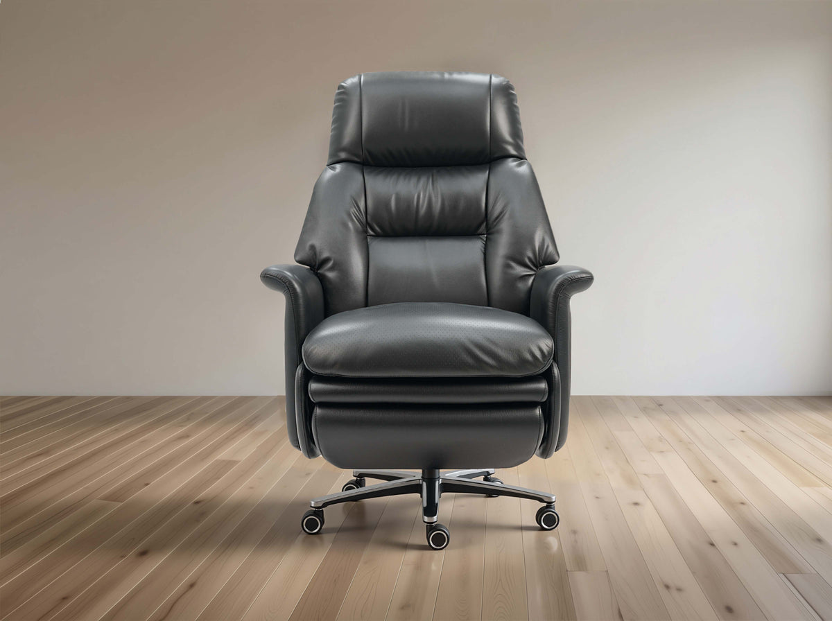 Black leather recliner chair on a wooden floor with a plain wall background